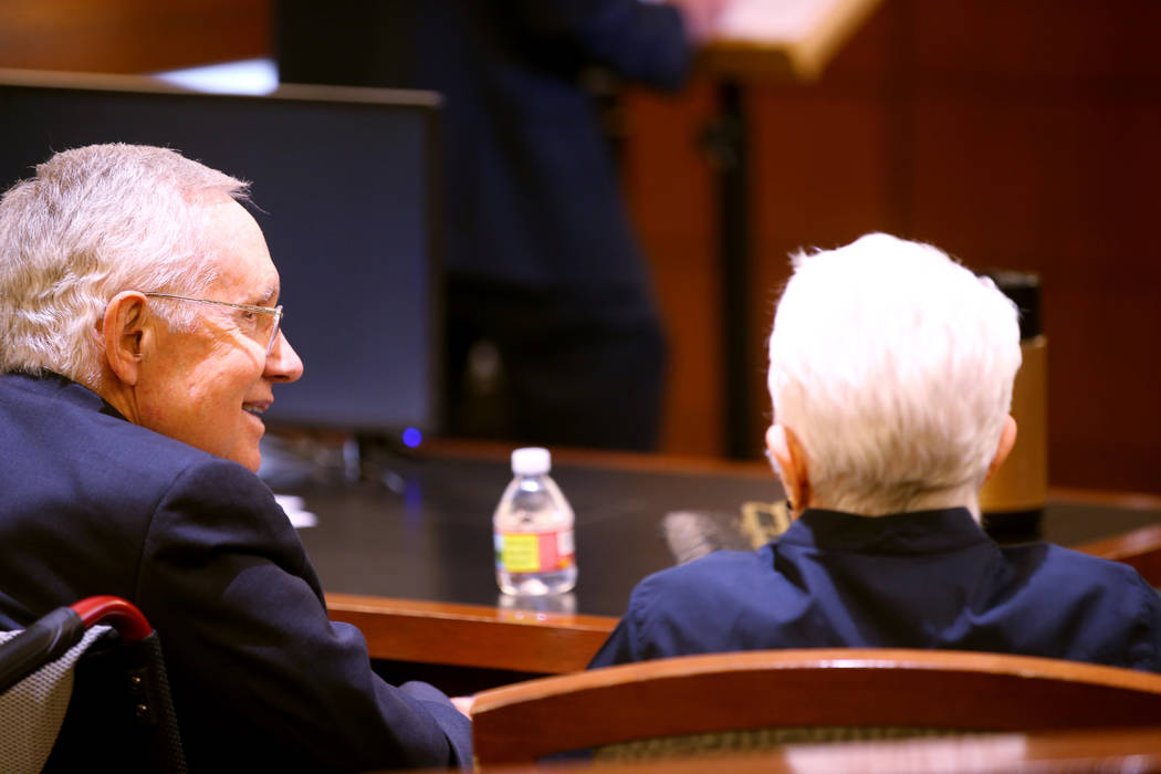 Former U.S. Sen. Harry Reid talks to his wife, Landra Gould, in the courtroom at the Regio ...