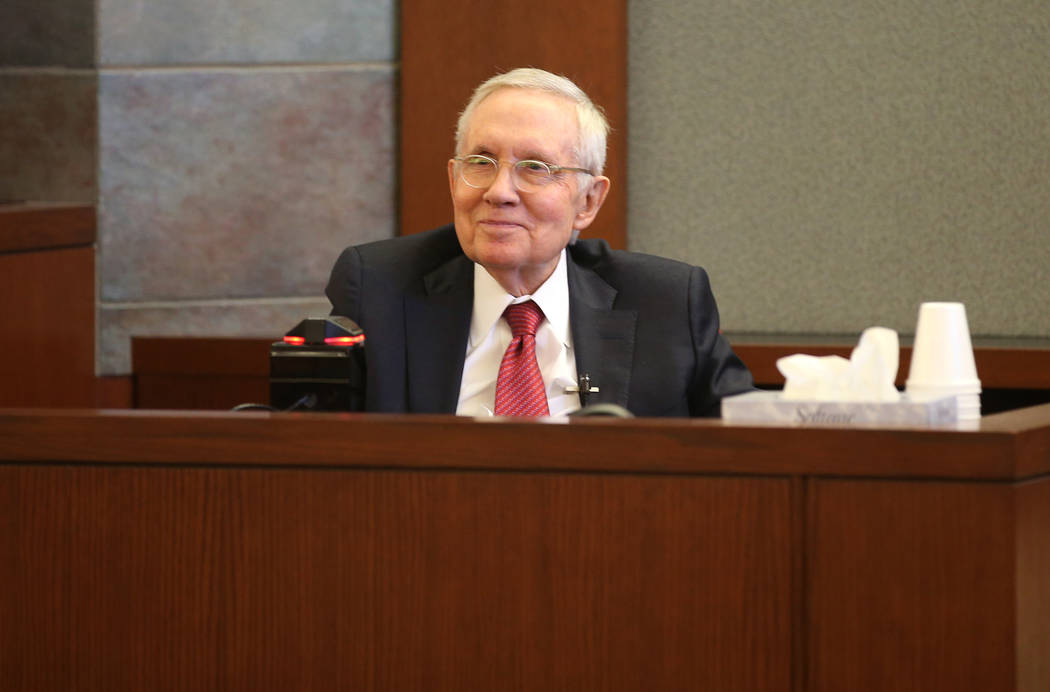 Former U.S. Sen. Harry Reid testifies in the courtroom at the Regional Justice Center in downto ...
