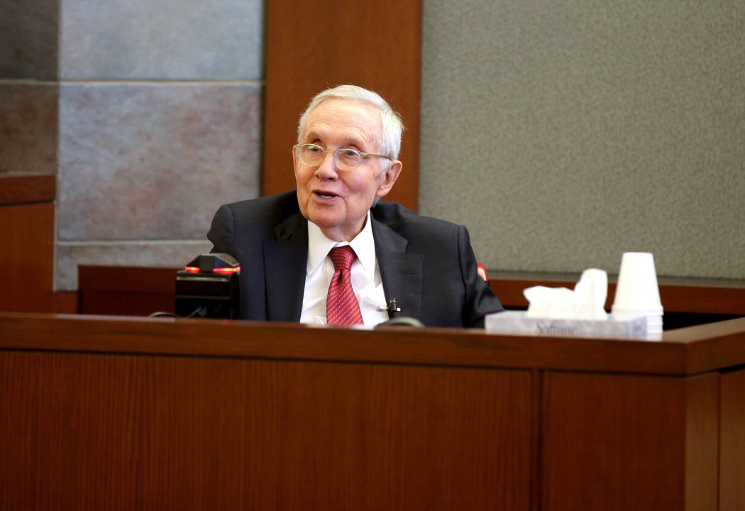 Former U.S. Sen. Harry Reid testifies in the courtroom at the Regional Justice Center in downto ...