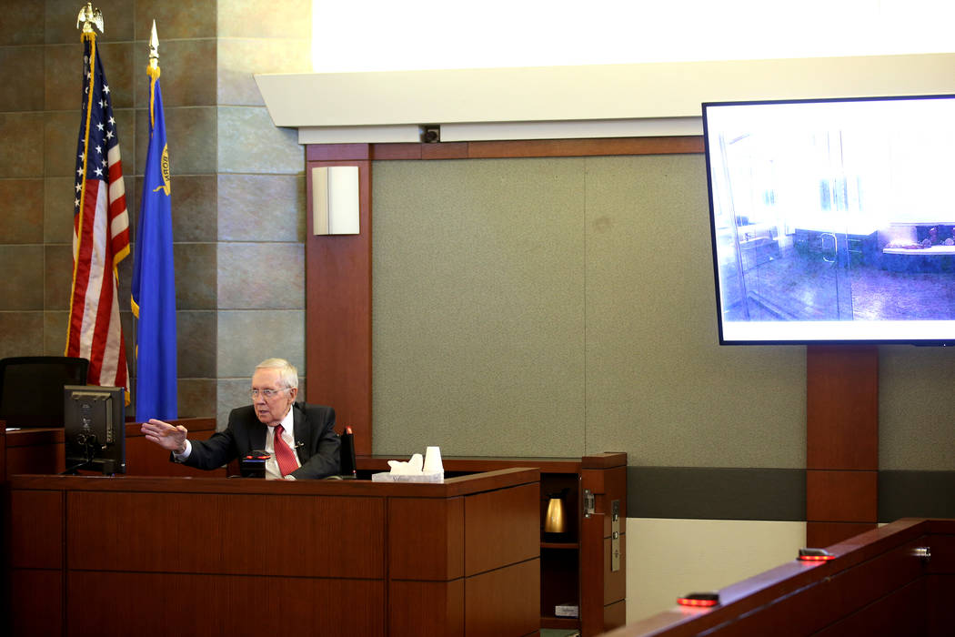 Former U.S. Sen. Harry Reid testifies in the courtroom at the Regional Justice Center in downto ...