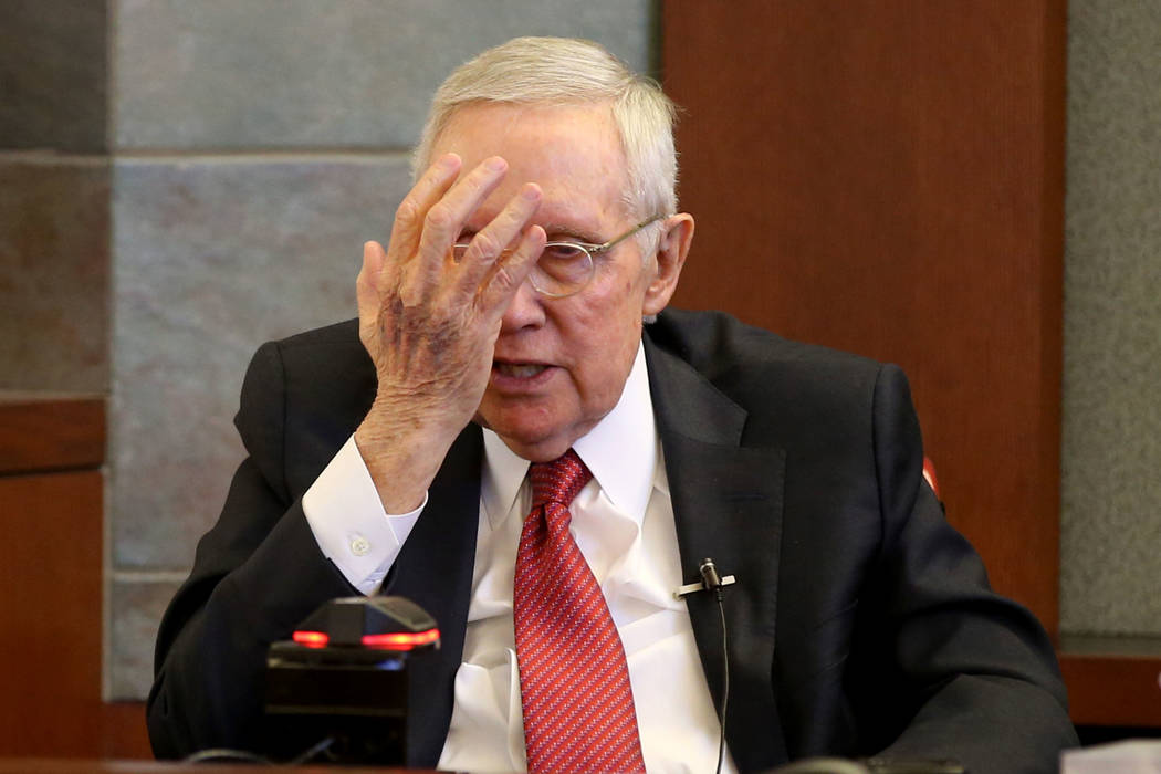 Former U.S. Sen. Harry Reid testifies in the courtroom at the Regional Justice Center in downto ...