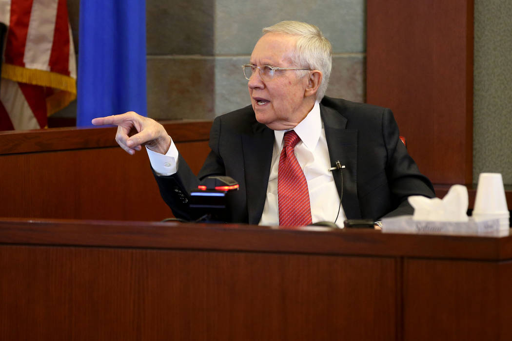 Former U.S. Sen. Harry Reid testifies in the courtroom at the Regional Justice Center in downto ...