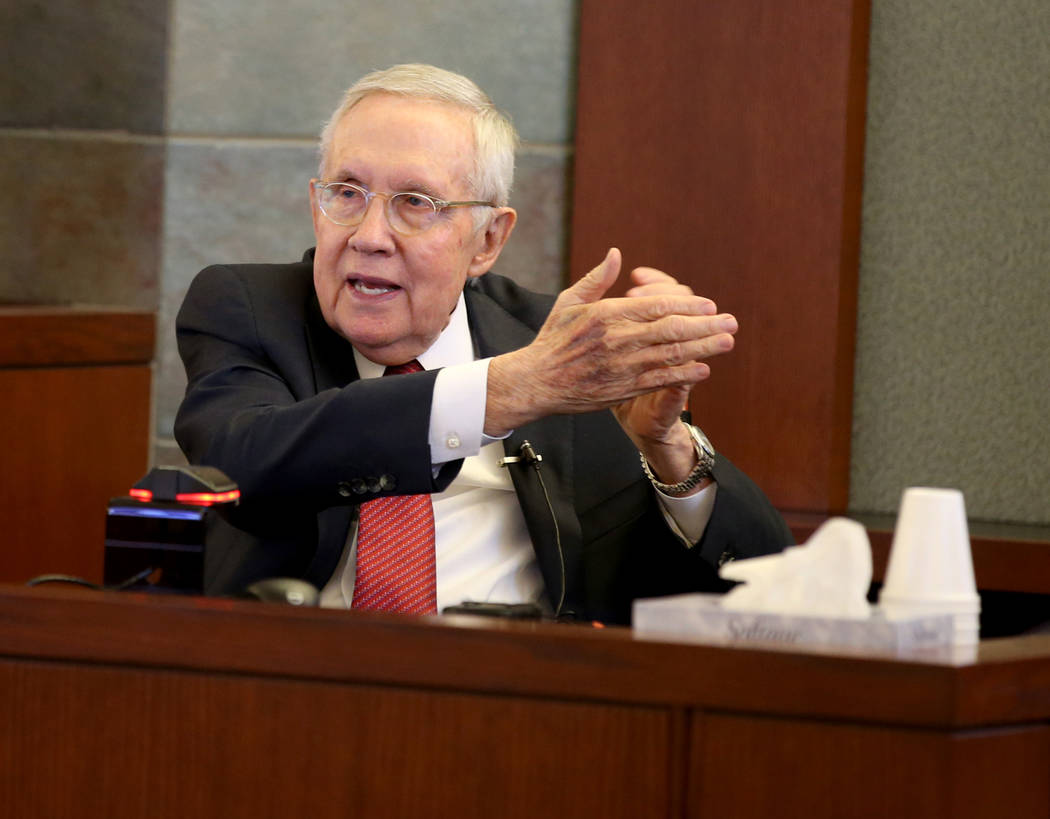 Former U.S. Sen. Harry Reid testifies in the courtroom at the Regional Justice Center in downto ...