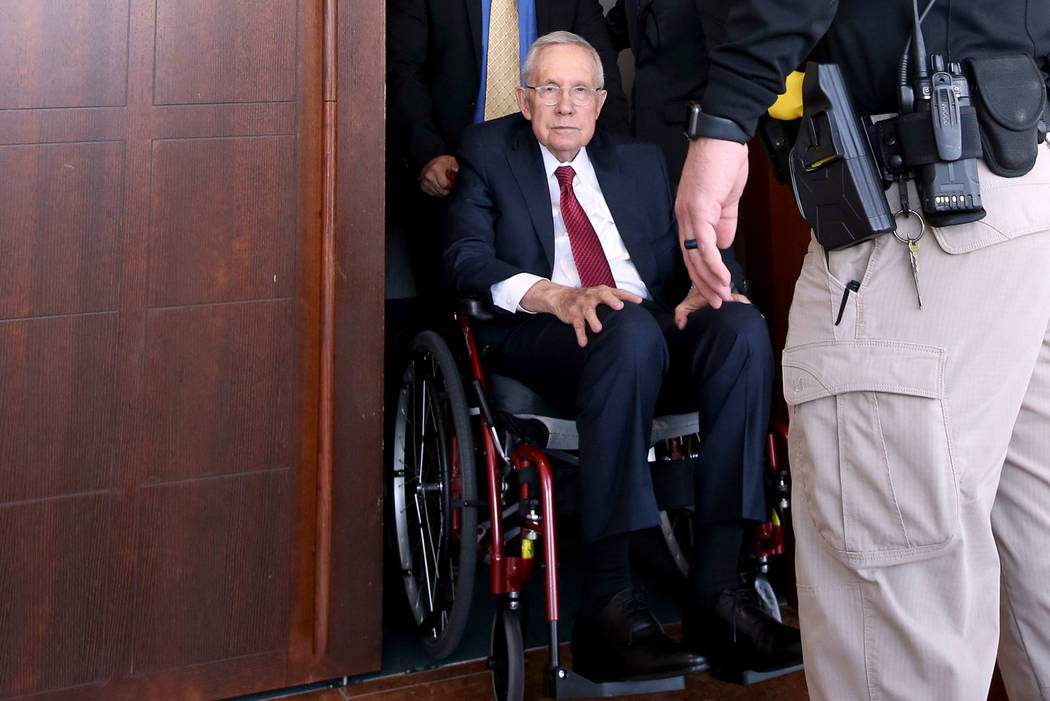 Former U.S. Sen. Harry Reid exits the courtroom at the Regional Justice Center in downtown Las ...