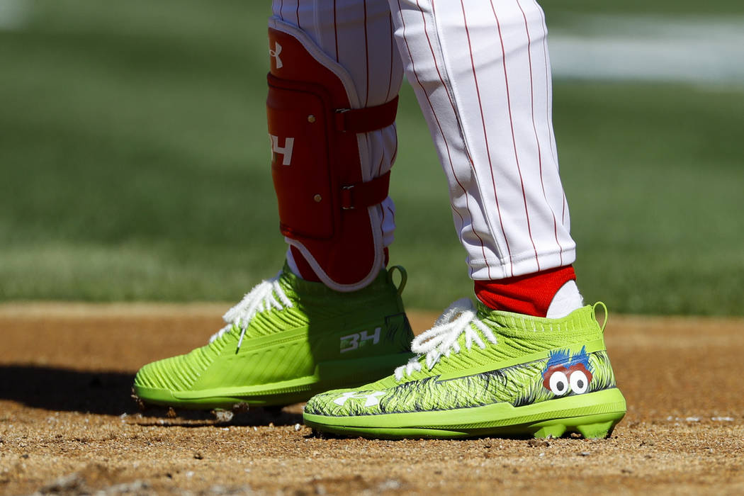 The cleats of Philadelphia Phillies' Bryce Harper are seen during the first inning of an openin ...