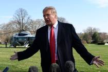 President Donald Trump talks with reporters before boarding Marine One on the South Lawn of the ...