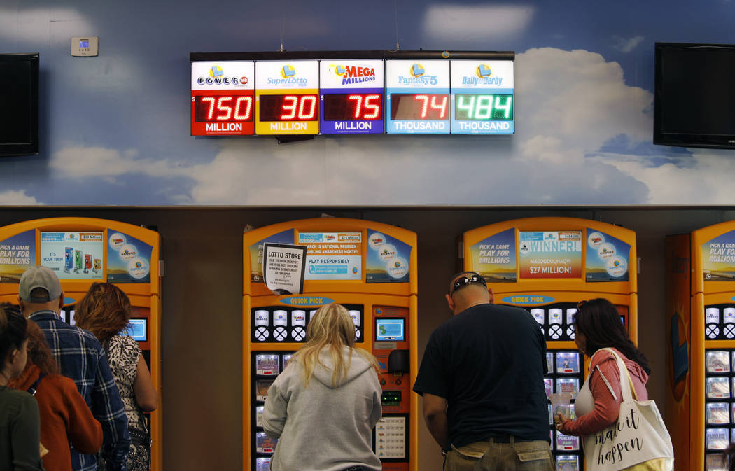 Jackpots, including the Powerball jackpot, are on display at the Lotto Store at Primm just insi ...