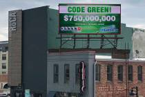 A billboard promotes an estimated $750 million Powerball jackpot in downtown Des Moines, Iowa, ...