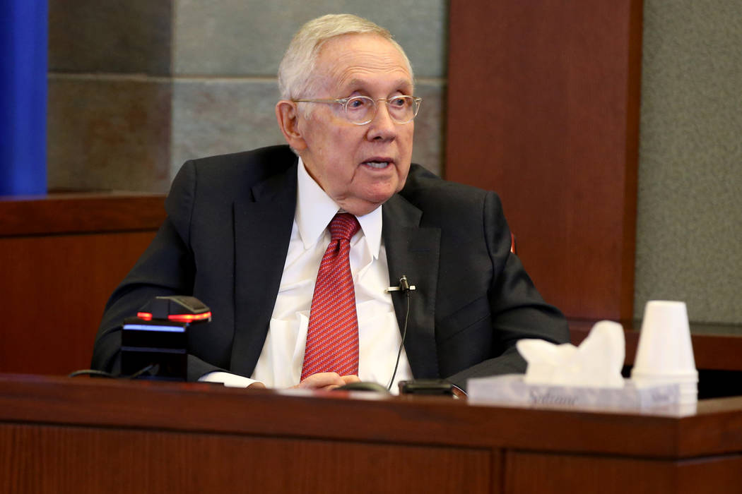 Former U.S. Sen. Harry Reid testifies in the courtroom at the Regional Justice Center in downto ...