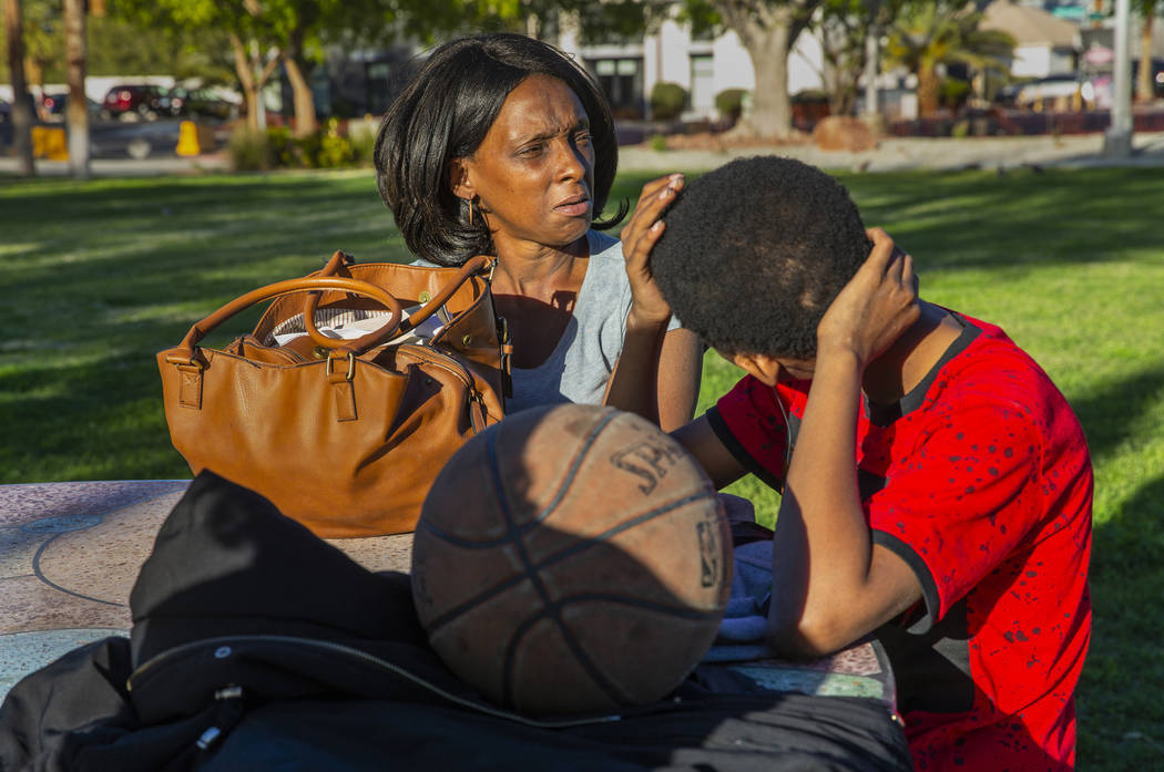 Reponzia Catron and her son Marion, 16, spend some time in Huntridge Circle Park which has long ...