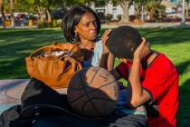 Reponzia Catron and her son Marion, 16, spend some time in Huntridge Circle Park which has long ...