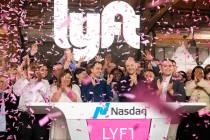 Lyft co-founders John Zimmer, front third from left, and Logan Green, front third from right, c ...