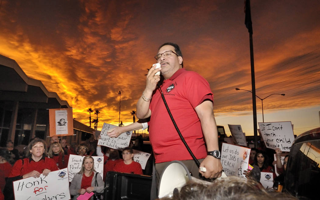 Clark County Education Association President Ruben Murillo, center, speaks during a CCEA rally ...