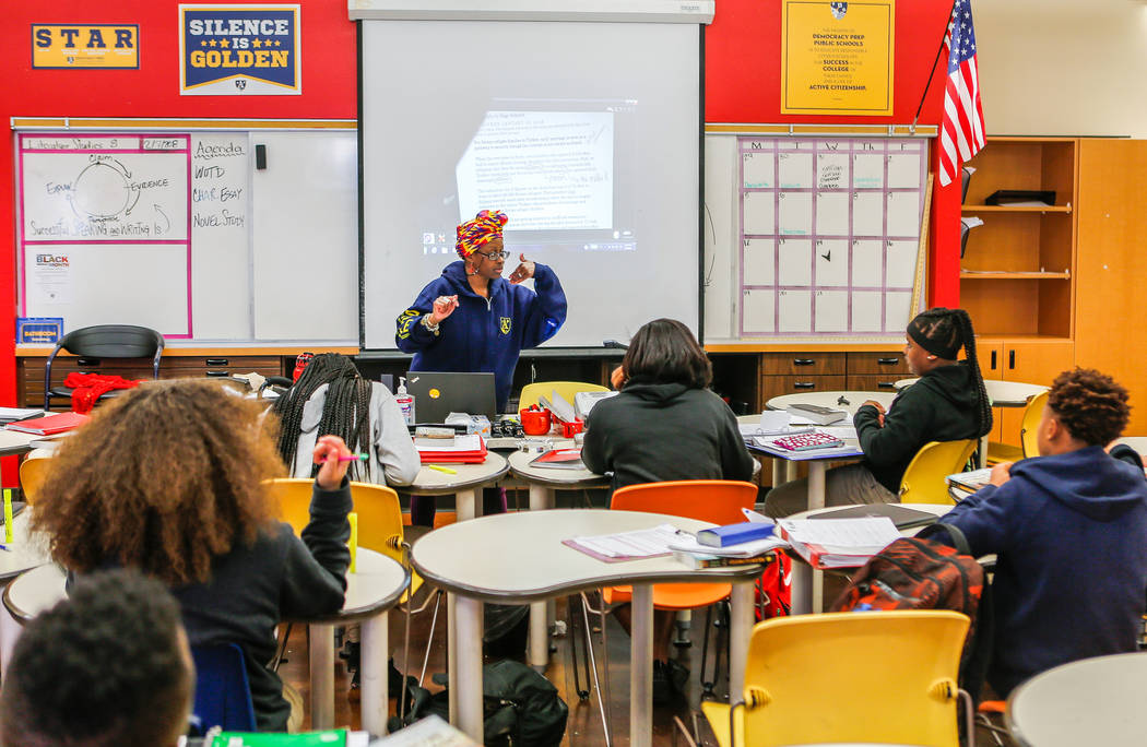 Students work in Jai Marin's eighth-grade literature class at Democracy Prep at Agassi Campus o ...
