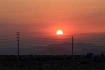 The sun rises over Summerlin on Friday, Aug. 3, 2018. Ozone season 2019 begins Monday. (Max Mic ...