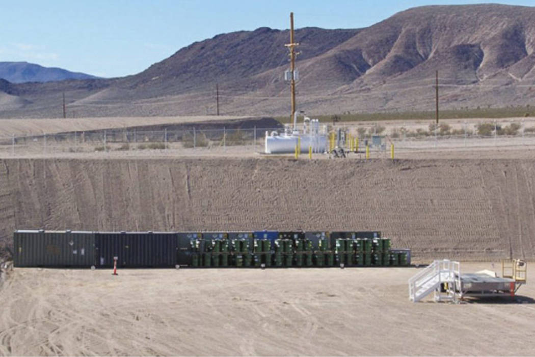 Waste packages are shown at the end of landfill cell in Area 5 at the Nevada National Security ...