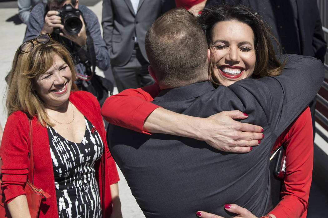 UNLV athletic director Desiree Reed-Francois, right, hugs new UNLV men's basketball coach T.J. ...