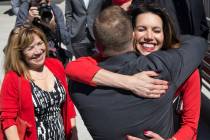 UNLV athletic director Desiree Reed-Francois, right, hugs new UNLV men's basketball coach T.J. ...