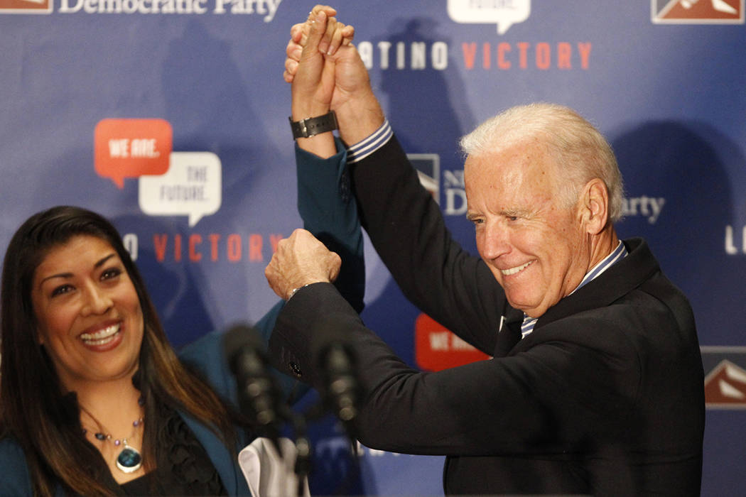 Lucy Flores, left, and Joe Biden, rally supporters during a get out the vote event at the union ...