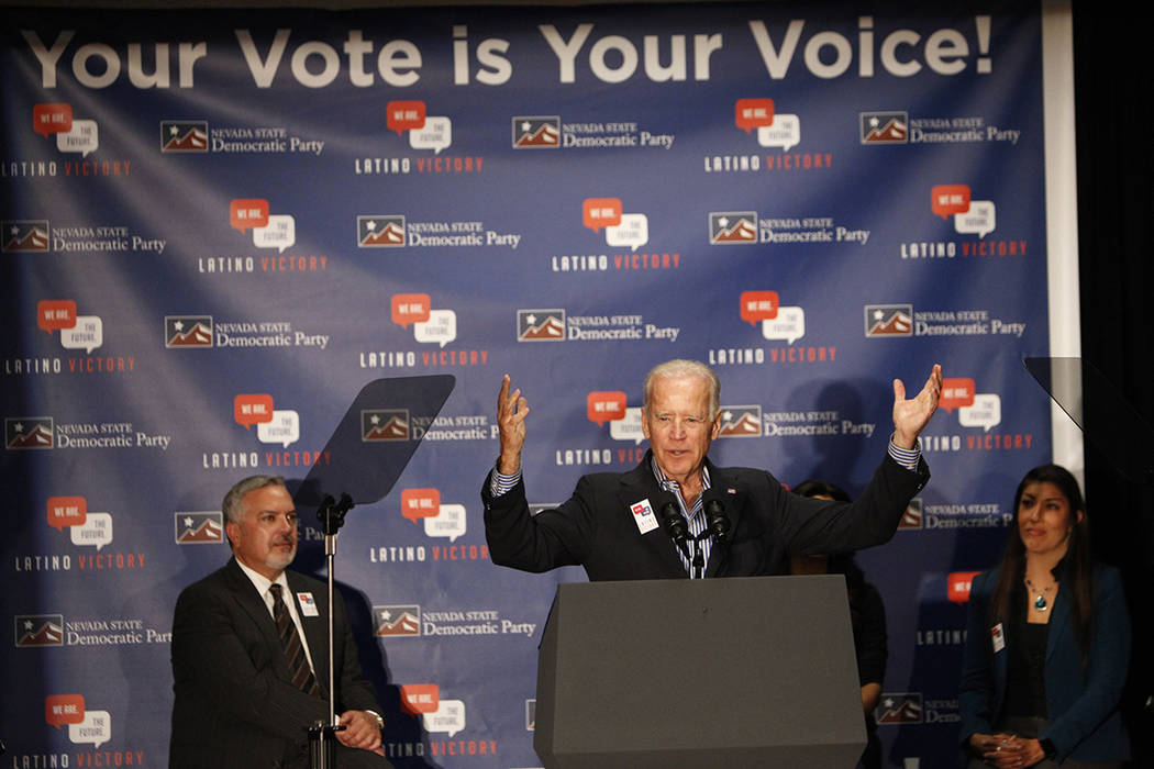 Vice President Joe Biden, center, speaks during a get out the vote event, with Henry R. Mu&#xf1 ...