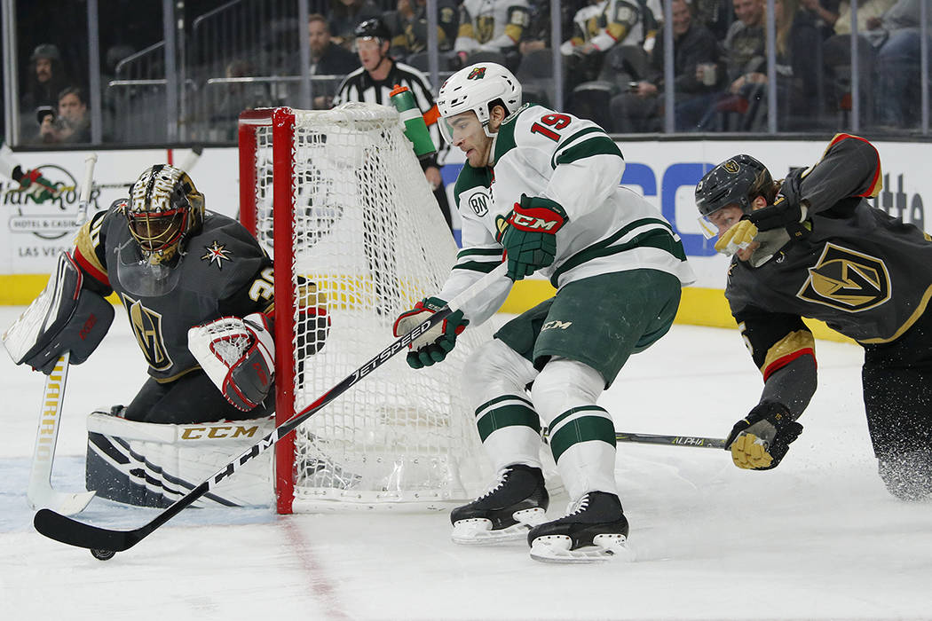 Minnesota Wild center Luke Kunin (19) shoots against Vegas Golden Knights goaltender Malcolm Su ...