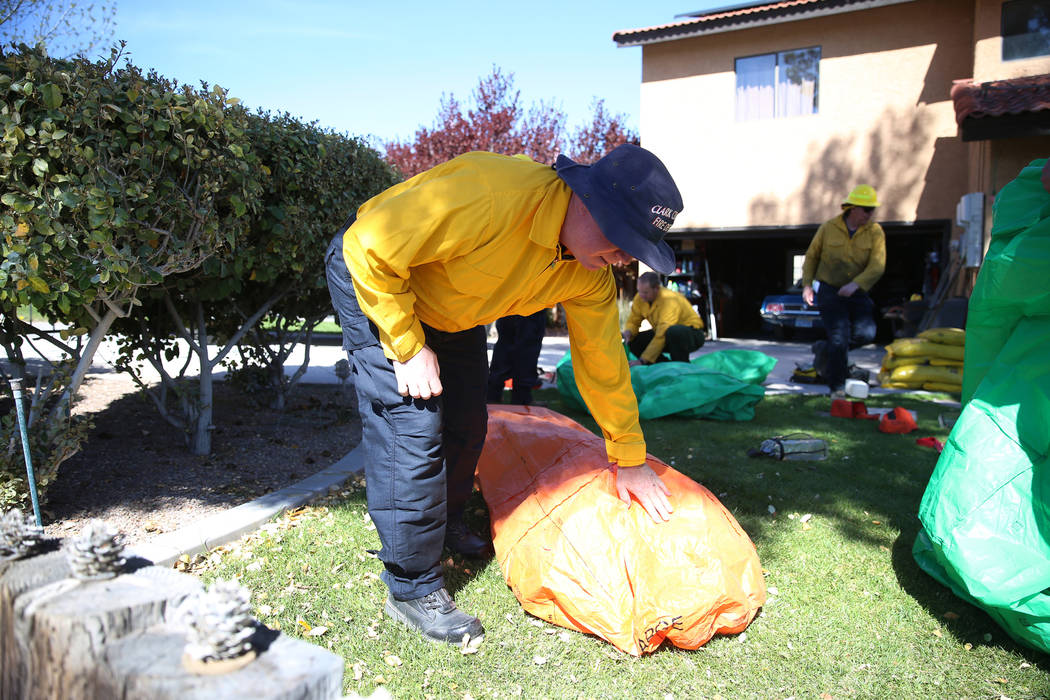 Gary Stevenson, training officer for the Clark County Fire Department, checks on a student usin ...