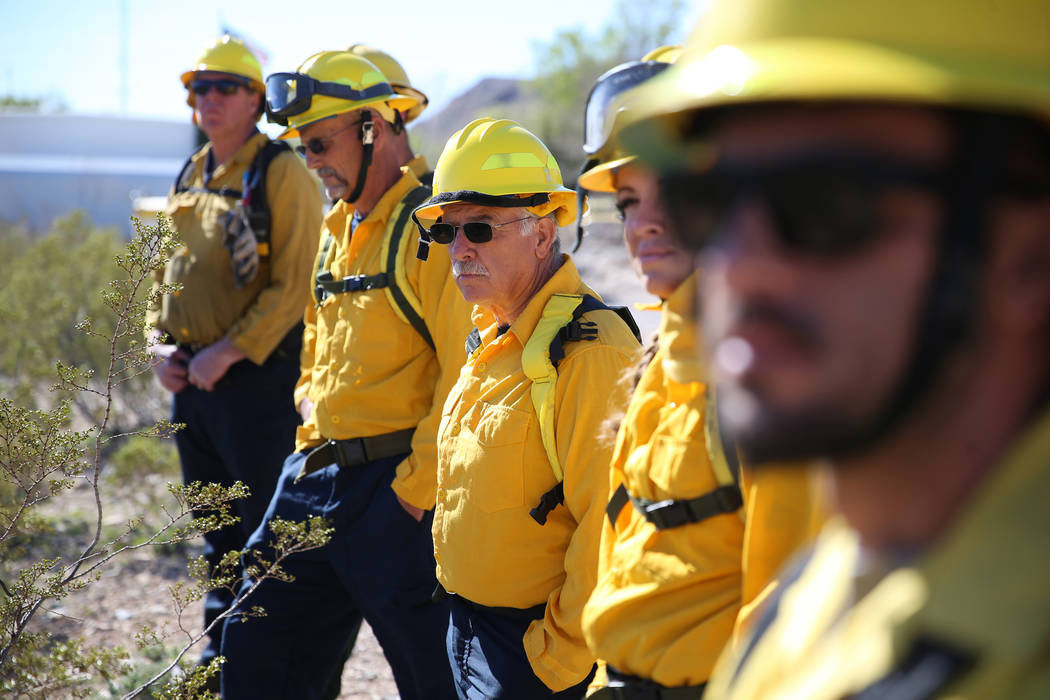 Faron Madderra, center, firefighter emergency medical technician, participates during a traini ...