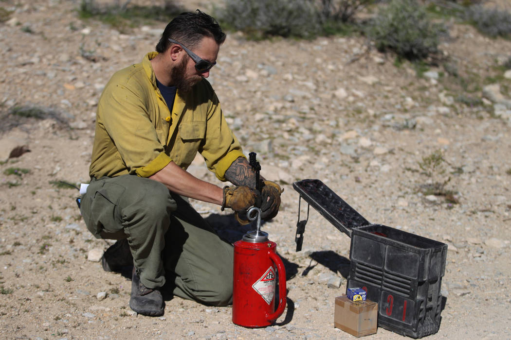 Kenneth Fruend, senior firefighter for the Bureau of Land Management at Red Rock, teaches how t ...