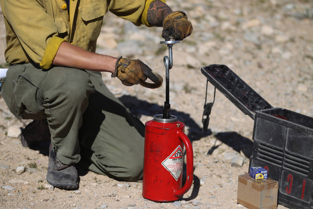 Kenneth Fruend, senior firefighter for the Bureau of Land Management at Red Rock, teaches how t ...