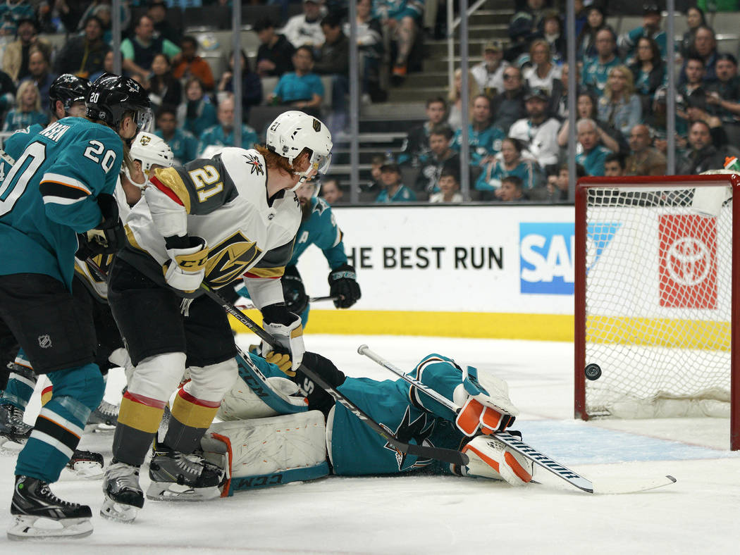 Vegas Golden Knights center Cody Eakin (21) scores a goal over San Jose Sharks goaltender Marti ...