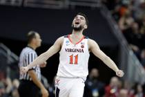 Virginia's Ty Jerome celebrates during overtime of the men's NCAA Tournament college basketball ...