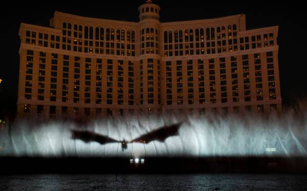 A dragon arrives during the debut of the new water show based on "Game of Thrones" at ...