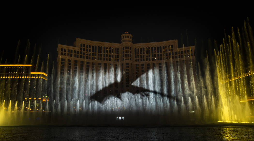 A dragon arrives during the debut of the new water show based on "Game of Thrones" at ...