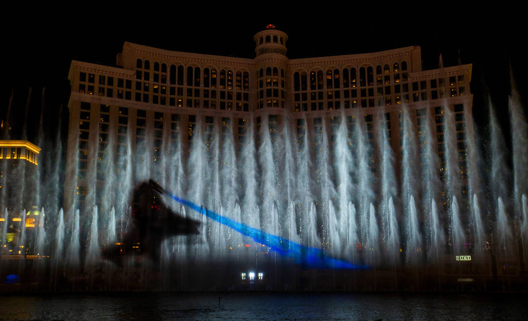 A dragon breathes fire during the debut of the new water show based on "Game of Thrones&qu ...