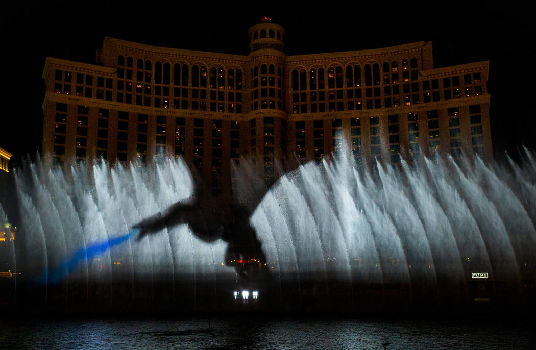 A dragon breathes fire during the debut of the new water show based on "Game of Thrones&qu ...