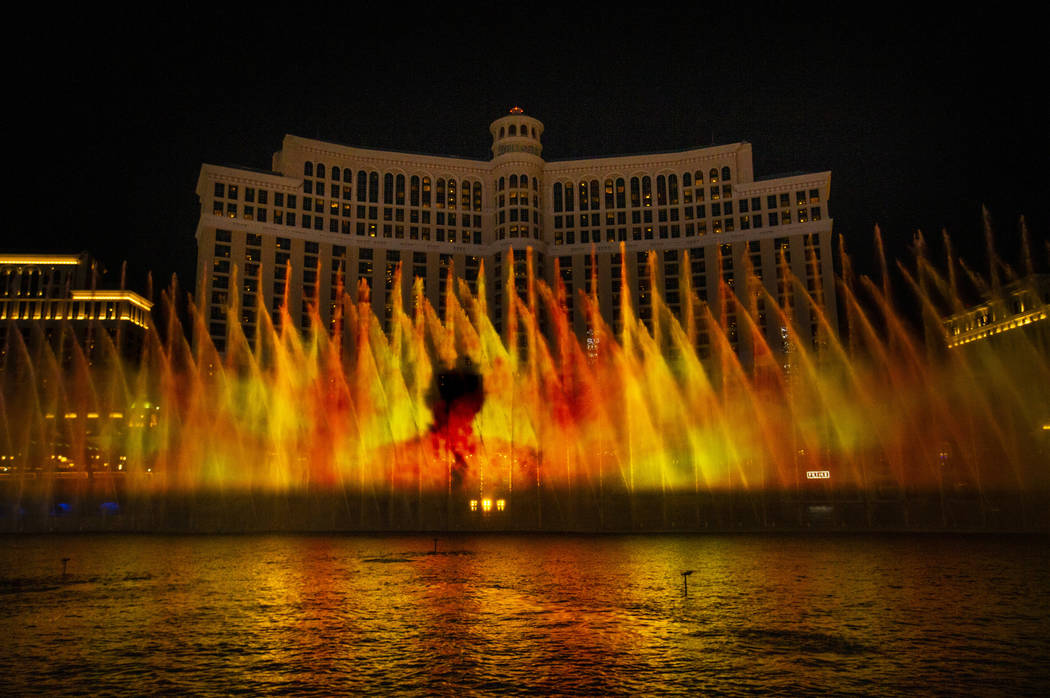 A man amongst flames during the debut of the new water show based on "Game of Thrones&quot ...
