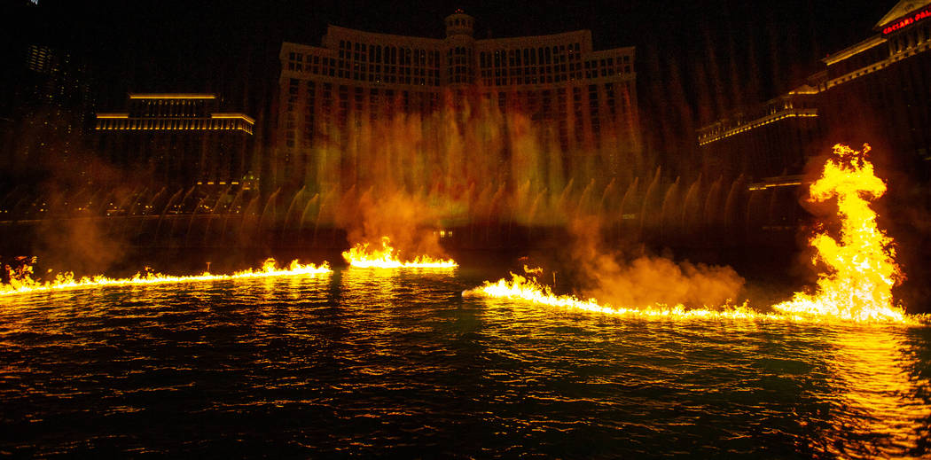 Flames burn on the water during the debut of the new water show based on ÒGame of Thrones& ...