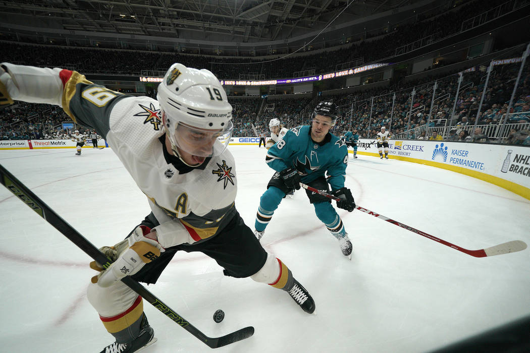 Vegas Golden Knights right wing Reilly Smith (19) battles for the puck against San Jose Sharks ...