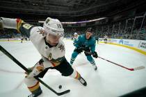Vegas Golden Knights right wing Reilly Smith (19) battles for the puck against San Jose Sharks ...