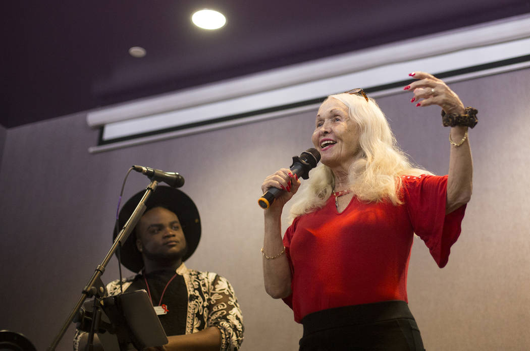 Judy Bowen speaks to the crowd next to host Rio Perkins at the Trans Day of Visibility event at ...