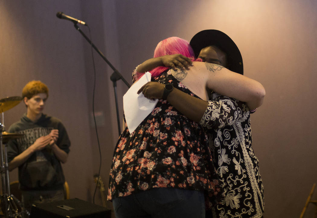 Rachel Rogers hugs host Rio Perkins after sharing her story at the Trans Day of Visibility even ...