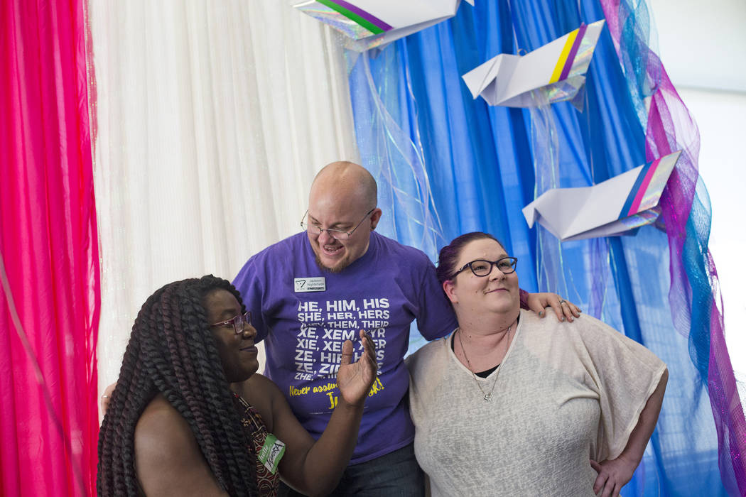 Kamora Jones, from left, Jackson Nightshade, and Amanda Jones pose for a photo at the Trans Day ...
