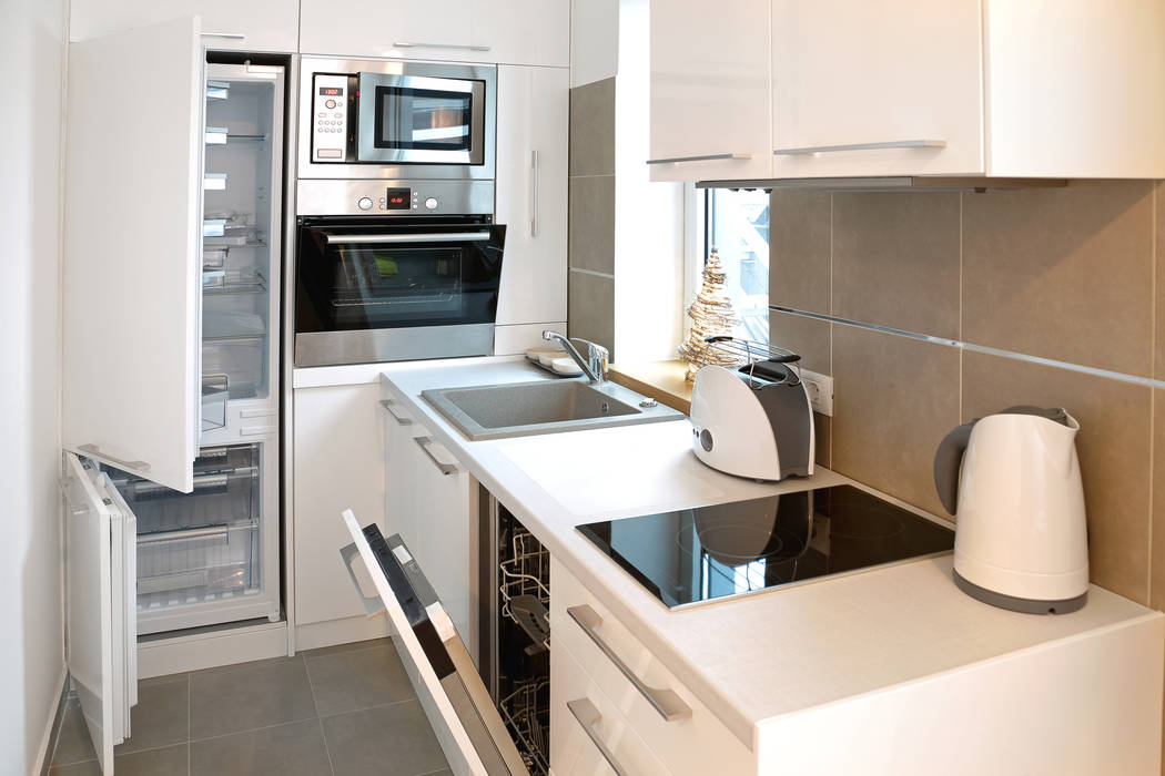 This small kitchen has everything you need: oven, microwave, two-burner cooktop, dishwasher and ...