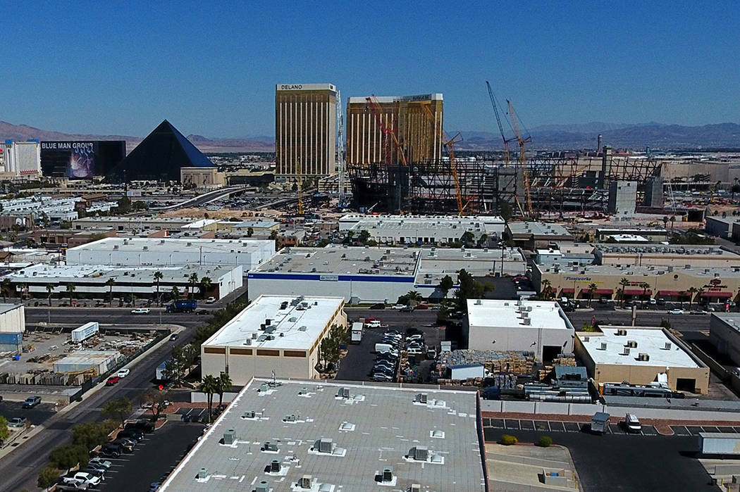 Aerial view of Raiders stadium, right center, in Las Vegas as it continues to take shape betwee ...