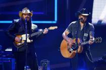 Chris Stapleton, left, and Jason Aldean perform at 2017 CMT Artist of the Year Awards at Nashvi ...