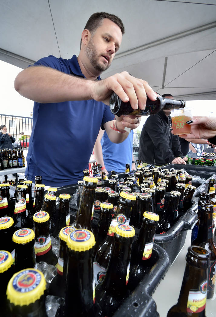 David Towill pours a beer at the Paulaner Brewing Company tent during the Great Vegas Festival ...