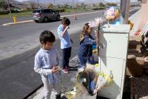Leo Yoshimori, 9, from left, and his siblings, Talan, 11, and Evelyn, 7, visit a memorial on So ...