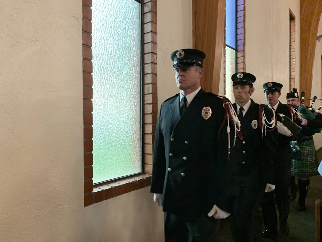 North Las Vegas Fire Department Honor Guard members Ryan Thatcher, front, Cameron Huges and Jor ...