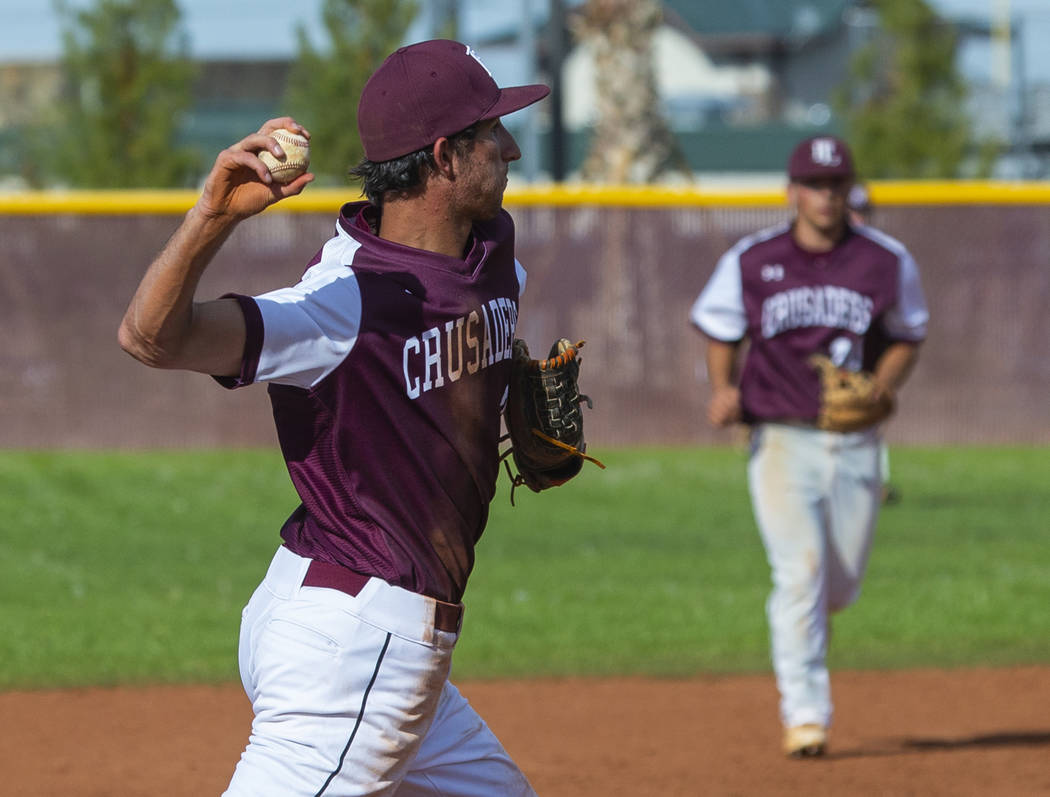 Faith Lutheran's Michael Rice (2) looks to first base on a throw versus Palo Verde during their ...