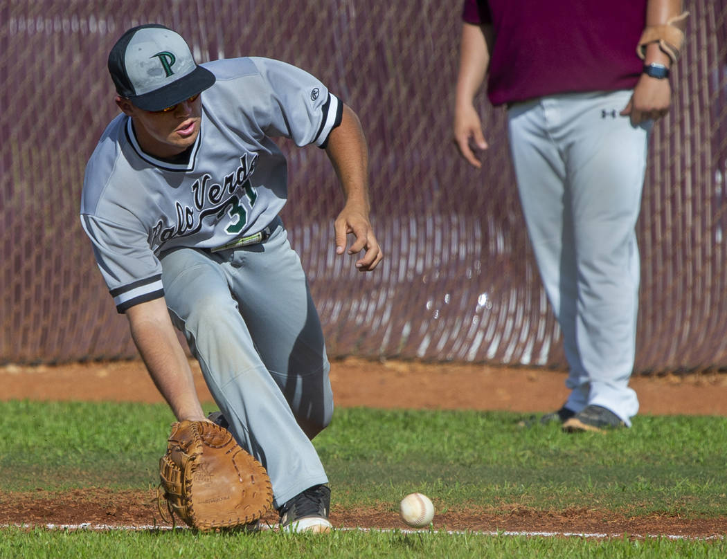 Palo Verde's Austin Raleigh (31) looks to a grounder from a Faith Lutheran batter during their ...